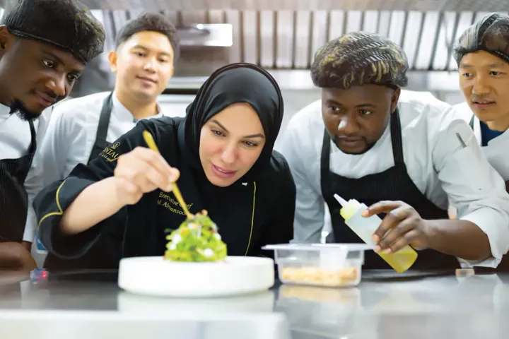 Chef Mariam and her brigade plating