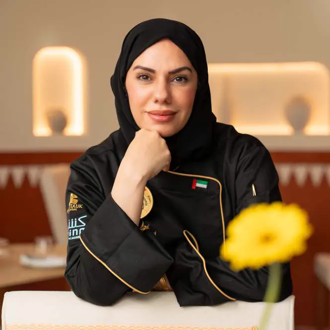 Portrait of Chef Mariam Al Mansoori in her chef jacket